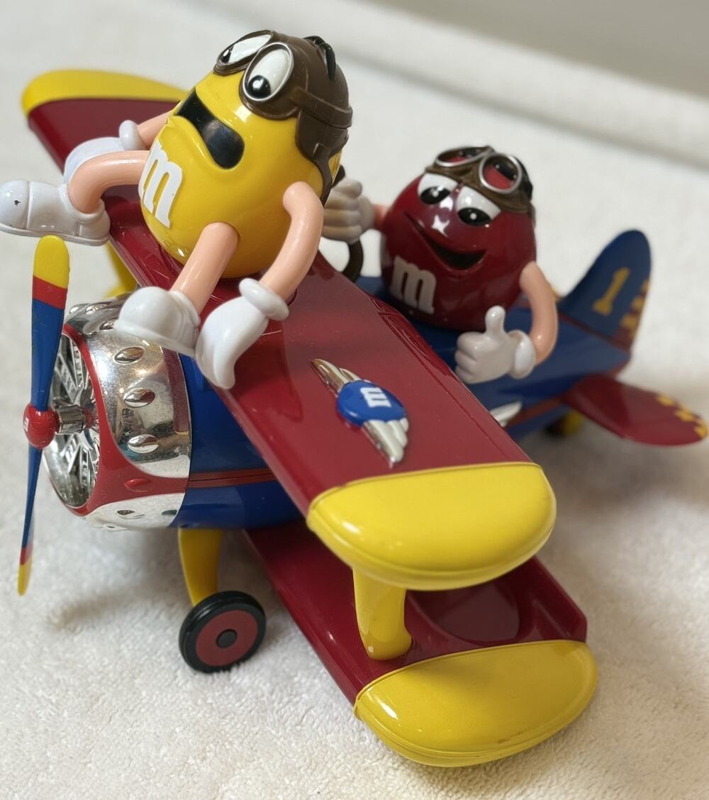M&M's Yellow Character Figure in Red/Yellow Biplane Candy & Nuts Theme